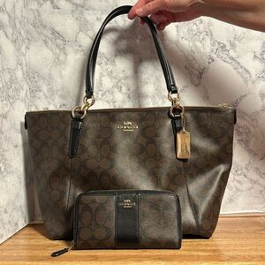 Brown coach purse and zipper around wallet trimmed in black